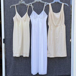 Group of 8 vintage slips and 3 vintage camisoles, size small unless noted